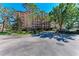 Beautiful condos with lush landscaping and mature trees providing a resort-style living experience at 5591 Cannes Cir # 403, Sarasota, FL 34231