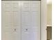 White closet doors with square hardware at 5591 Cannes Cir # 403, Sarasota, FL 34231