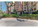 Beautiful multi-story condo building featuring lush landscaping and a secure entry at 5591 Cannes Cir # 403, Sarasota, FL 34231