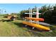 Community kayak rack with multiple kayaks stored on a sunny day at 5591 Cannes Cir # 403, Sarasota, FL 34231