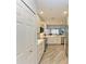 Bright kitchen featuring white cabinets, stainless steel appliances, and an open floor plan at 5591 Cannes Cir # 403, Sarasota, FL 34231