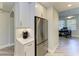 Bright modern kitchen with stainless steel refrigerator and coffee bar at 5591 Cannes Cir # 403, Sarasota, FL 34231