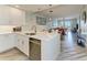 Modern, eat-in kitchen with white cabinets, stainless steel appliances and quartz countertops at 5591 Cannes Cir # 403, Sarasota, FL 34231