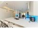Modern kitchen with white cabinets, quartz countertops, and pendant lighting at 5591 Cannes Cir # 403, Sarasota, FL 34231