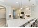 Modern kitchen with white cabinets, quartz countertops, and stainless appliances at 5591 Cannes Cir # 403, Sarasota, FL 34231