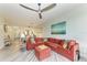Spacious living room with a large sectional sofa and beach-themed artwork at 5591 Cannes Cir # 403, Sarasota, FL 34231