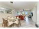 Spacious living room with modern lighting, comfortable seating, and sliding glass doors at 5591 Cannes Cir # 403, Sarasota, FL 34231