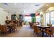 Clubhouse bar with pub tables and chairs offer space for residents to relax and socialize at 5591 Cannes Cir # 403, Sarasota, FL 34231