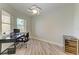 Bright office with a desk, wine cooler, and a view, perfect for work or study at 5591 Cannes Cir # 403, Sarasota, FL 34231