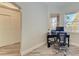 Light-filled office space with wood-look floors and a view of the outdoors at 5591 Cannes Cir # 403, Sarasota, FL 34231