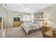 Comfortable bedroom with a ceiling fan, multiple windows, a dresser, and a relaxing ambiance at 5665 Midnight Pass Rd # 410, Sarasota, FL 34242
