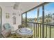 Charming lanai with seating and scenic water views offering a tranquil outdoor living space at 5665 Midnight Pass Rd # 410, Sarasota, FL 34242