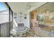 Relaxing screened-in lanai provides a comfortable space with views of the interior living area at 5665 Midnight Pass Rd # 410, Sarasota, FL 34242