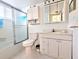 Well-maintained bathroom featuring a shower, toilet, vanity with storage and a mirrored medicine cabinet at 5904 Palm Ln # C23, Bradenton, FL 34207