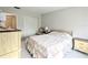 Bright bedroom featuring light walls, neutral carpeting and a double bed with matching floral quilt at 5904 Palm Ln # C23, Bradenton, FL 34207