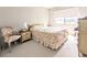 Inviting bedroom with a double bed, chair, and bedside tables, designed for comfortable living at 5904 Palm Ln # C23, Bradenton, FL 34207