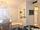 Open living space with view of dining, kitchen, and entry at 5904 Palm Ln # C23, Bradenton, FL 34207