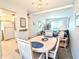 Bright dining area flowing into the living room, perfect for entertaining guests at 5904 Palm Ln # C23, Bradenton, FL 34207
