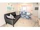 Cozy living room showcasing comfortable seating, neutral carpeting and an abundance of natural light at 5904 Palm Ln # C23, Bradenton, FL 34207