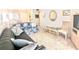 Inviting living room with neutral carpeting, comfortable sofas, and an abundance of natural light at 5904 Palm Ln # C23, Bradenton, FL 34207