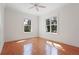 Bright bedroom with hardwood flooring, large windows, and neutral paint, creating a serene atmosphere at 5954 River Forest Cir, Bradenton, FL 34203