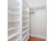 Walk-in closet with lots of shelving and storage, designed to provide ample space for your belongings at 5954 River Forest Cir, Bradenton, FL 34203