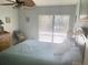 Inviting bedroom with a fan, a large window, and a cozy atmosphere at 6157 Midnight Pass Rd # E42, Sarasota, FL 34242