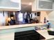 Modern kitchen open to the living area with stainless steel appliances at 6157 Midnight Pass Rd # E42, Sarasota, FL 34242