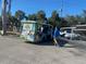 Street view featuring a Vacation King Tours bus near the complex at 6157 Midnight Pass Rd # E42, Sarasota, FL 34242