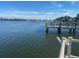 Picturesque water view featuring a wooden pier and peaceful waterfront scenery at 6157 Midnight Pass Rd # E42, Sarasota, FL 34242