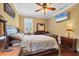 Bedroom with a ceiling fan, and a window with white shutters at 6211 90Th Avenue E Cir, Parrish, FL 34219