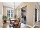 Breakfast nook with a view to the outside lanai and a round wood table with chairs at 6211 90Th Avenue E Cir, Parrish, FL 34219