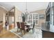 Cozy dining room with a chandelier, a neutral color scheme, and views to the outdoors at 6211 90Th Avenue E Cir, Parrish, FL 34219