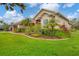 Lovely home showcasing manicured landscaping, a well-kept lawn, and architectural details at 6211 90Th Avenue E Cir, Parrish, FL 34219