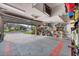 Spacious garage with tiled floors and ample storage solutions providing organization and protection for vehicles and belongings at 6211 90Th Avenue E Cir, Parrish, FL 34219