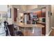 Kitchen with granite countertops, stainless steel appliances, and breakfast bar with seating at 6211 90Th Avenue E Cir, Parrish, FL 34219