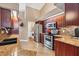 Modern kitchen with stainless steel appliances, granite countertops, and lots of storage at 6211 90Th Avenue E Cir, Parrish, FL 34219