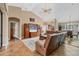 Inviting living area with a large TV, comfortable seating, and views into the adjacent dining room at 6211 90Th Avenue E Cir, Parrish, FL 34219