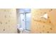 Bathroom with floral wallpaper, a walk-in shower, and a functional toilet showcasing a practical layout at 6834 Fairview Ter # 6834, Bradenton, FL 34203