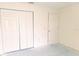 Bright bedroom features neutral walls and a large closet at 6834 Fairview Ter # 6834, Bradenton, FL 34203