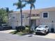 Inviting two-story townhome with a tile roof, white garage doors, and lush landscaping at 6834 Fairview Ter # 6834, Bradenton, FL 34203