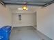 The home's spacious one-car garage featuring an automatic door and lighting at 6834 Fairview Ter # 6834, Bradenton, FL 34203