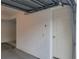The home's garage featuring a door to the interior of the house at 6834 Fairview Ter # 6834, Bradenton, FL 34203