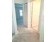 An unfinished hallway leads to other rooms, showcasing the home's layout and potential for customization at 6834 Fairview Ter # 6834, Bradenton, FL 34203