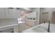 Bright kitchen featuring white cabinetry, modern appliances, and a large basin sink at 6834 Fairview Ter # 6834, Bradenton, FL 34203
