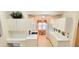 Bright kitchen featuring white cabinetry, modern appliances, and adjacent breakfast nook at 6834 Fairview Ter # 6834, Bradenton, FL 34203