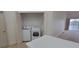 A laundry closet featuring a dryer and washer unit, offering a functional laundry solution for residents at 6834 Fairview Ter # 6834, Bradenton, FL 34203