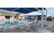 Inviting community pool with plenty of lounge chairs and shaded seating areas at 6834 Fairview Ter # 6834, Bradenton, FL 34203