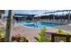 Inviting community pool with plenty of lounge chairs and shaded seating areas at 6834 Fairview Ter # 6834, Bradenton, FL 34203