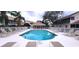 Community pool with lounge chairs and a shaded cabana area for residents at 6834 Fairview Ter # 6834, Bradenton, FL 34203